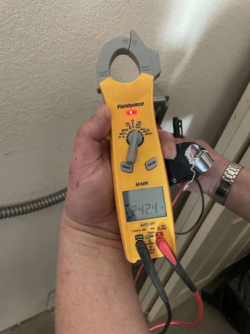 Voltage testing with clamp meter during Electrical Installation Services in East Pikeland